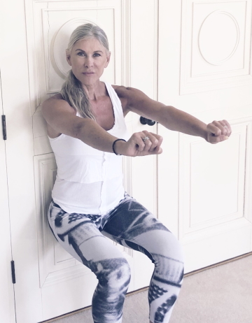 Sharron exercising by door
